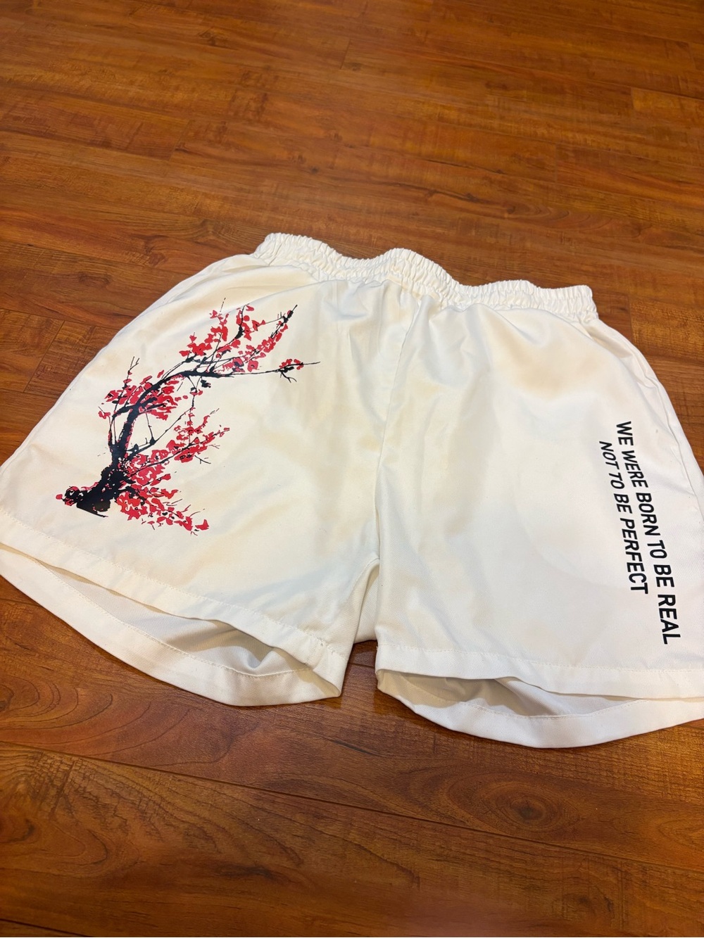 White mens Elastic-Waist Shorts with Cherry Blossom Print